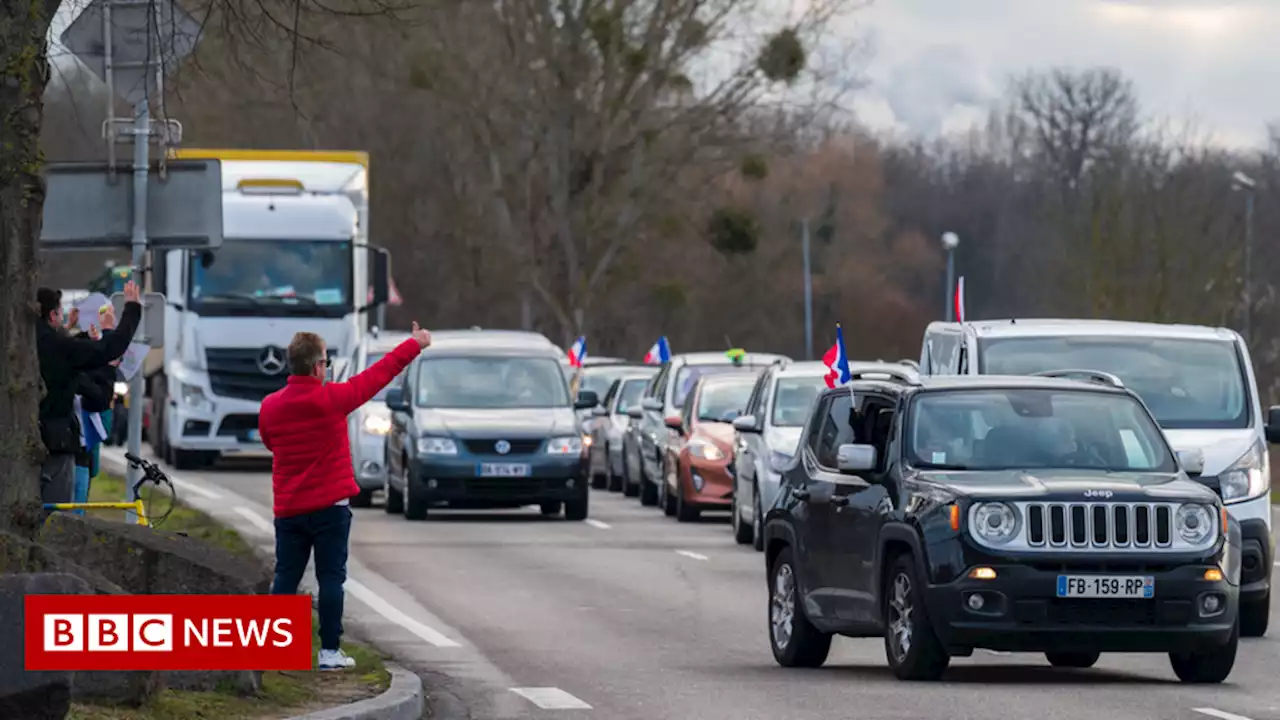 Macron calls for calm as convoy of protestors nears Paris