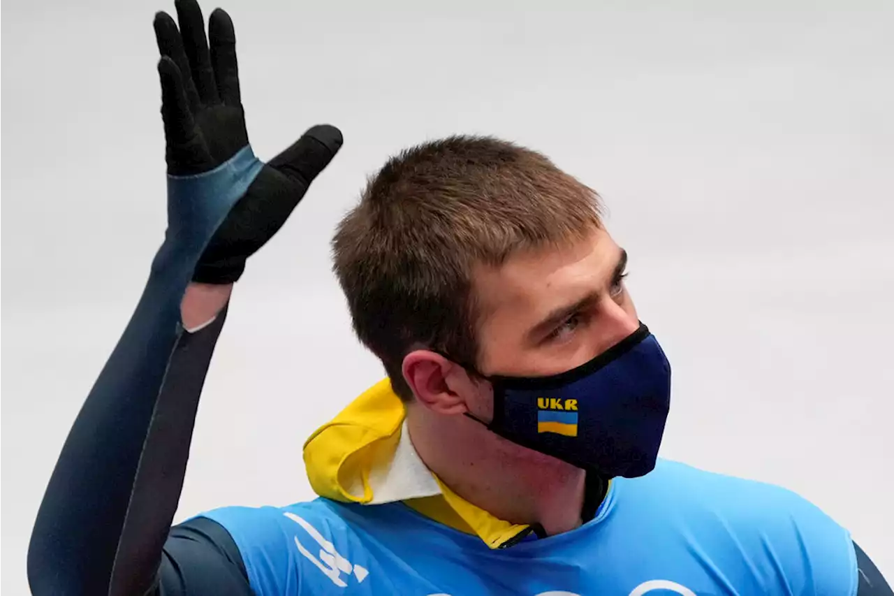 Ukrainian Athlete Engages In First Political Protest At Beijing Olympics, Unfurls Sign To TV Cameras