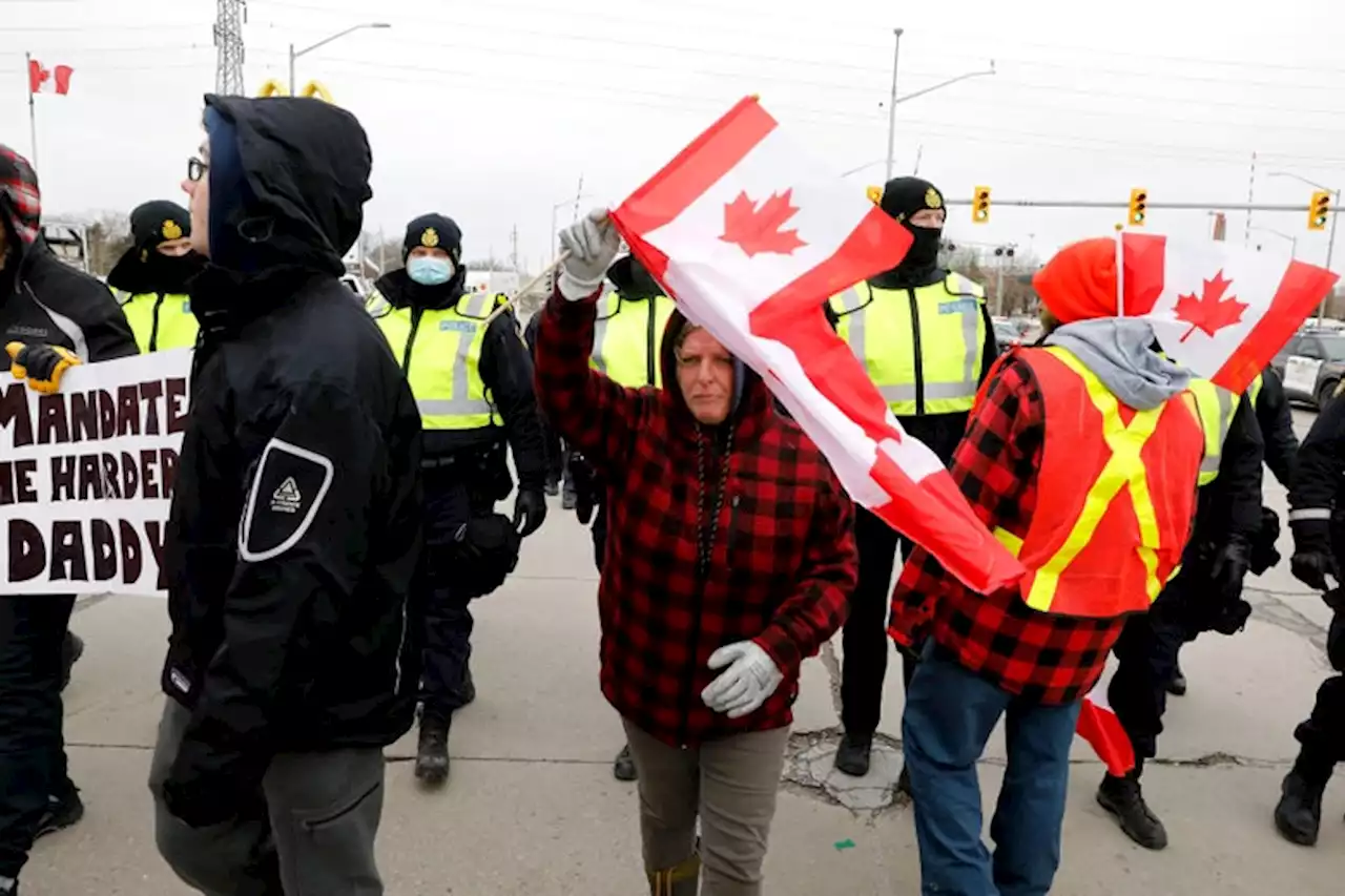 Canada Police Clearing Protesters Blocking Ambassador Bridge to U.S.