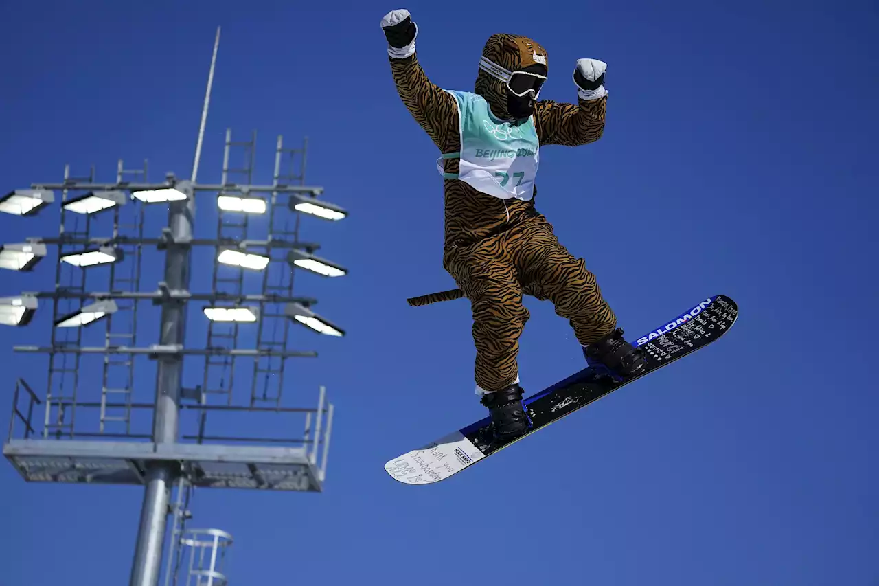 Injured Olympian gets big air in big-cat costume for kicks