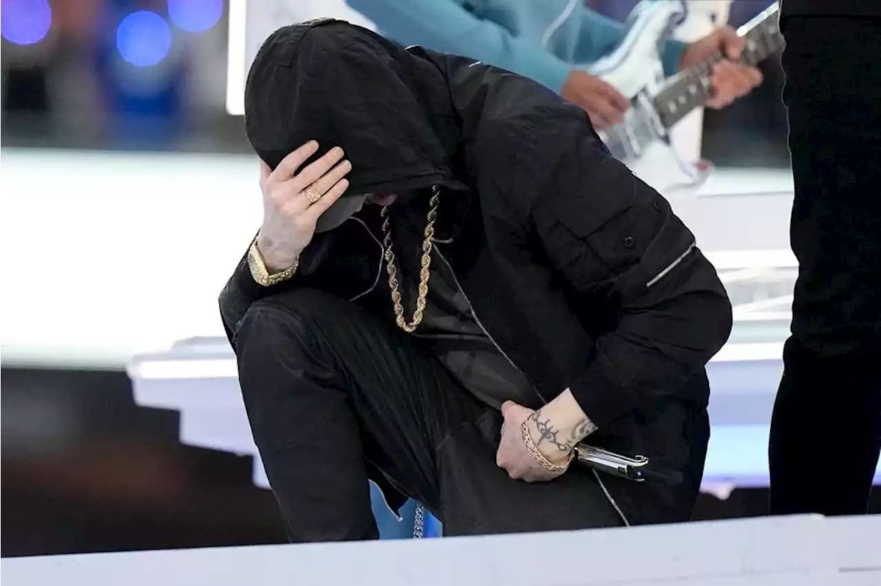 Eminem takes a knee during the Super Bowl halftime show