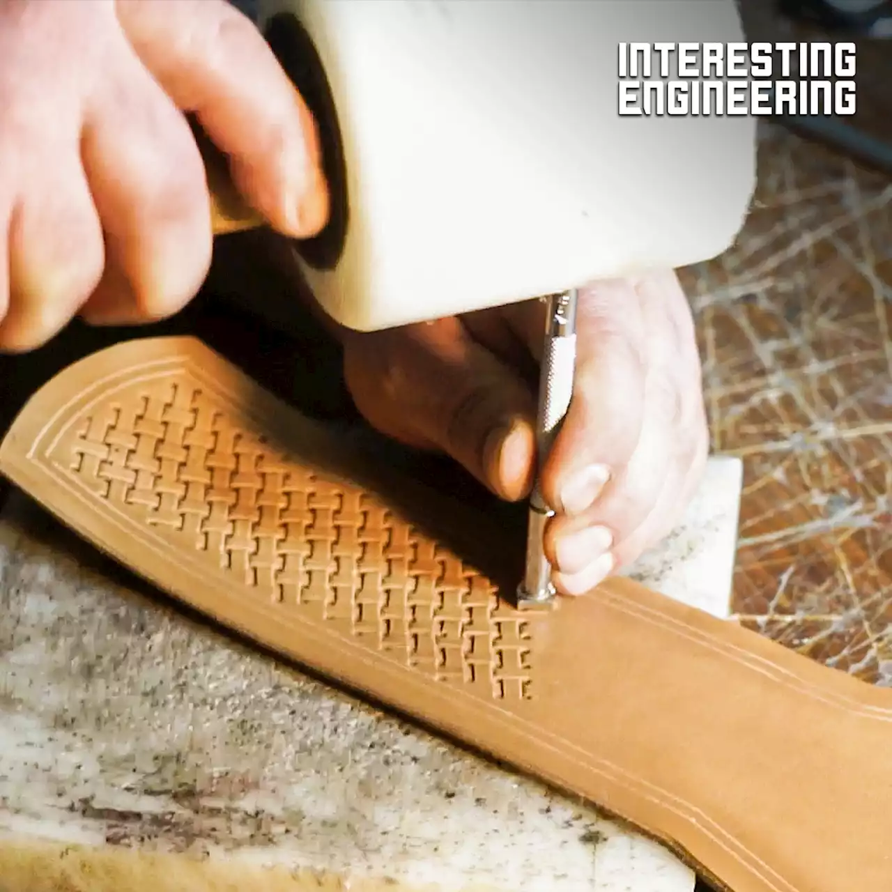 Watch a master leathersmith make an elegant sheath for axe