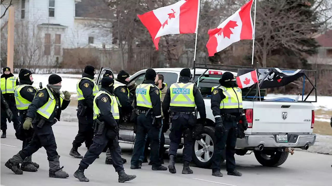 Key US-Canada border bridge cleared as police move in on protesting truckers