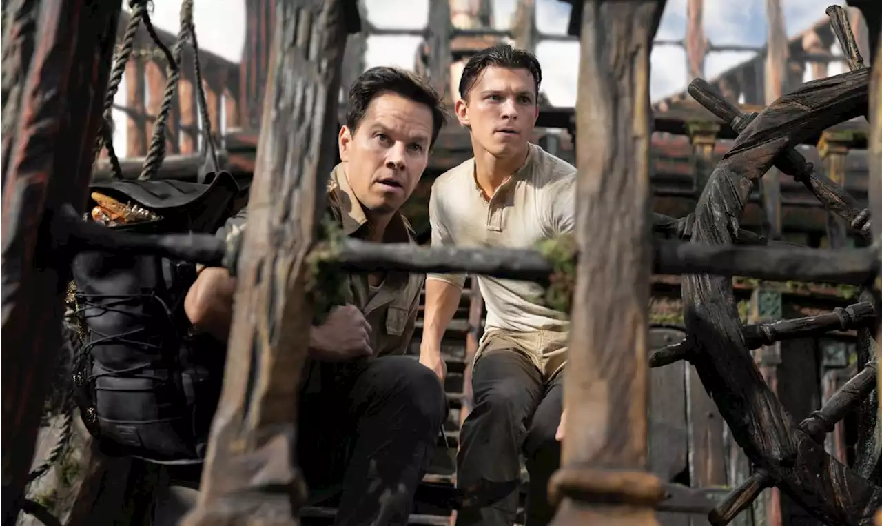 Review: ‘Uncharted’ gets a little lost, though Mark Wahlberg and Tom Holland are fun to watch