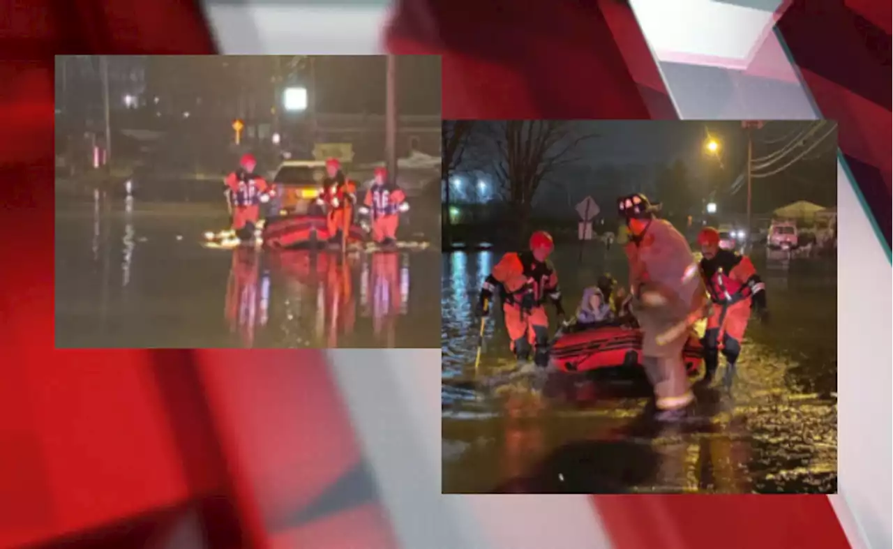 Family who drove car into high water rescued by boat by Canton firefighters