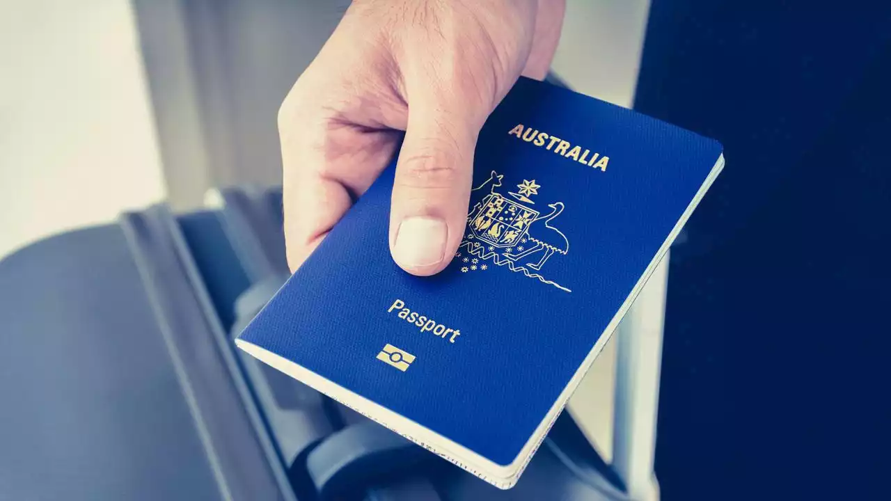 Passport wait times spike as Aussies escape