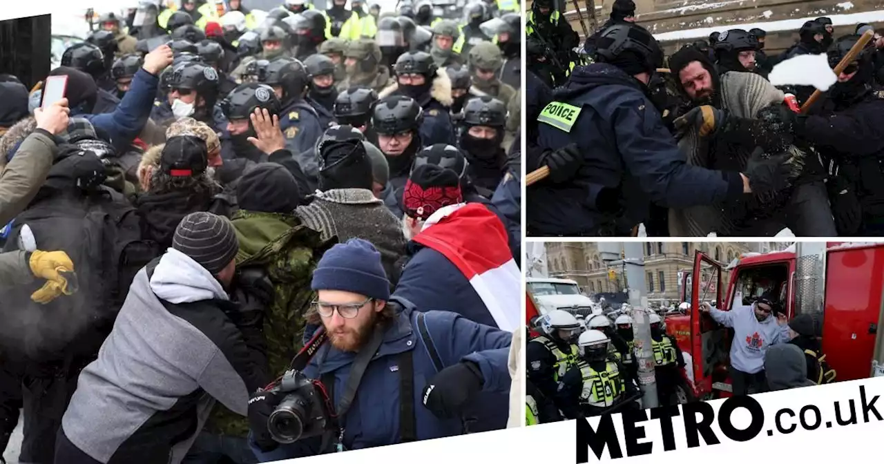 Canadian police use pepper spray and stun grenades to clear Covid protesters