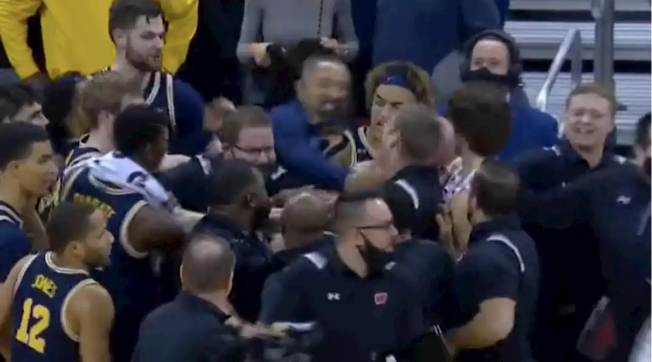 Michigan Coach Juwan Howard Takes Swing at a Wisconsin Assistant Coach