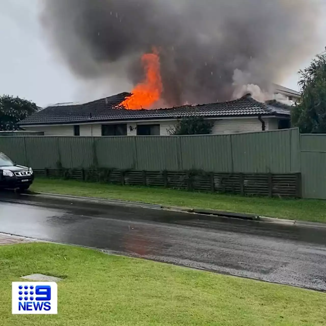 House destroyed after suspected lightning strike, as wild storm lashes Sydney