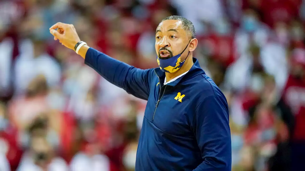 Michigan coach Juwan Howard hits Wisconsin assistant Joe Krabbenhoft after a loss