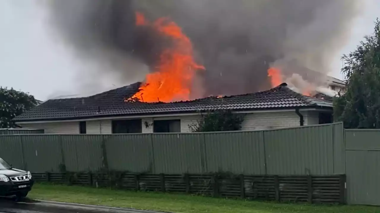 Severe storms to batter Sydney as house is destroyed by suspected lightning strike