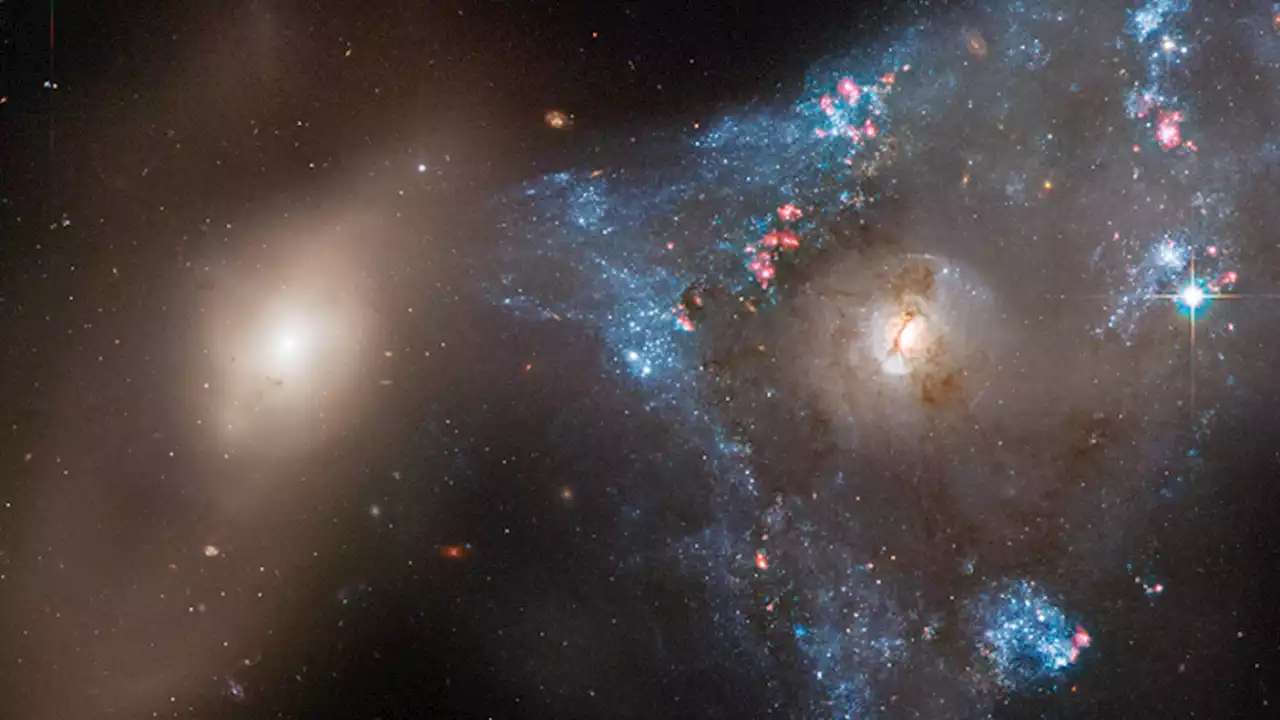 Hubble telescope spots a 'Space Triangle' galaxy crash spawning 'tsunami of starbirth'