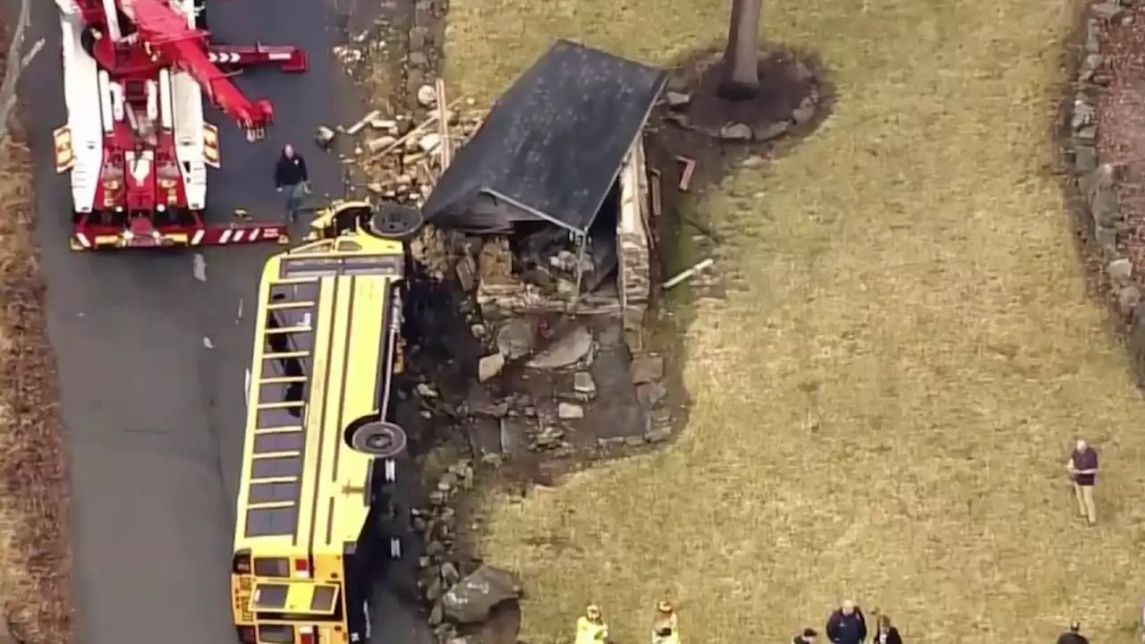 NJ School Bus Slams Into Boulder, Then Historic Building and Flips in Wild Crash