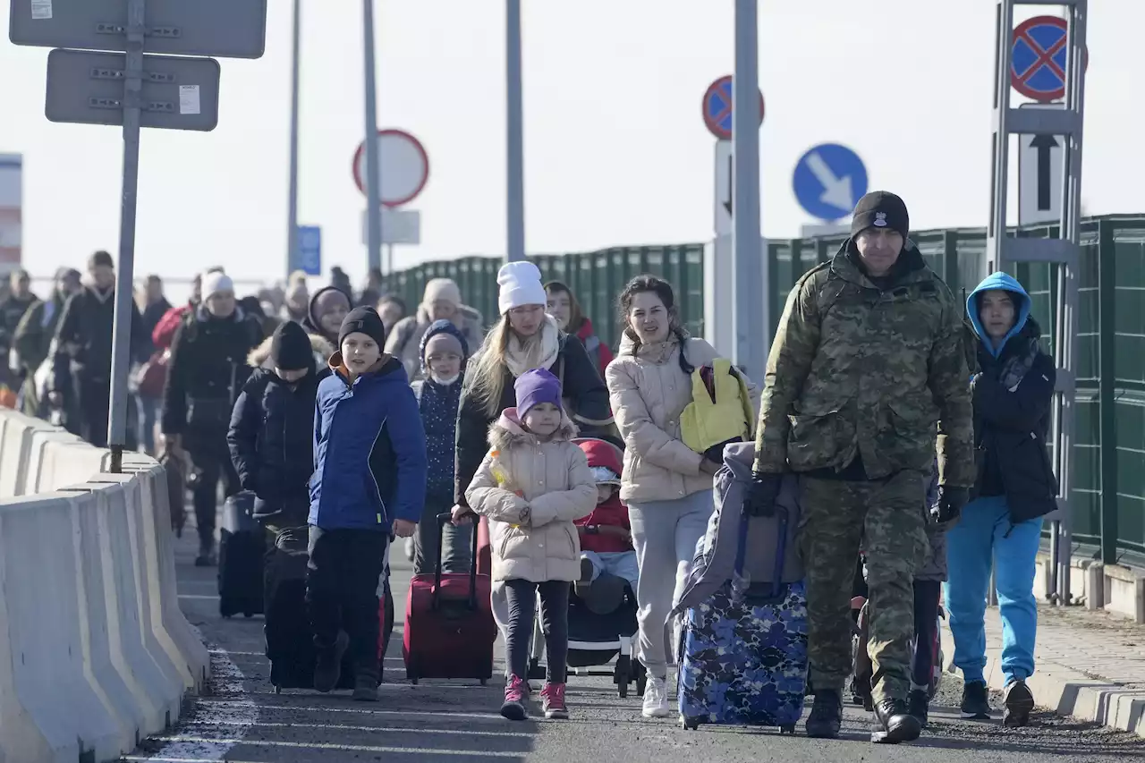 Live updates: Miles-long lines of cars clog Ukraine borders