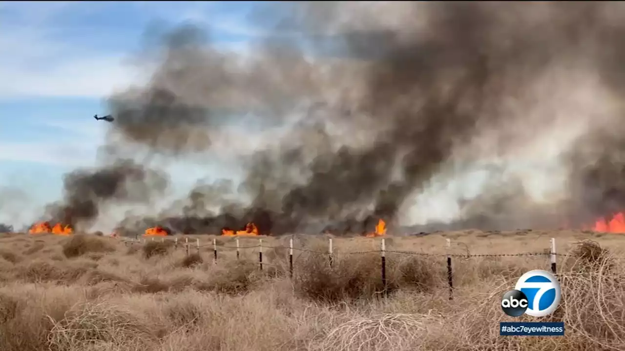 Crews battle brush fire burning near Air Force manufacturing plant in Palmdale