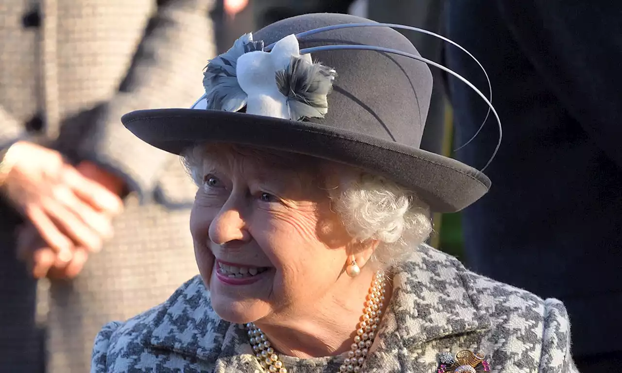 The Queen looks so elegant in striking red lipstick during drive in Sandringham