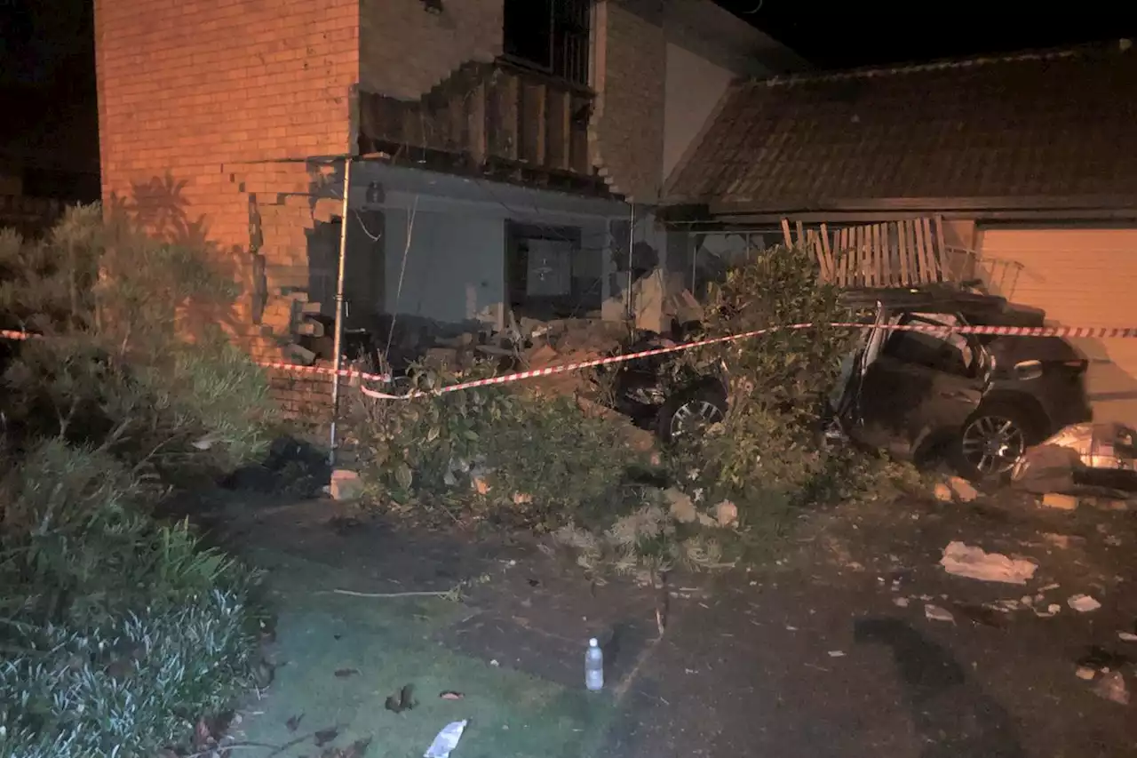 Car smashes into Brisbane home, woman found lying unconscious