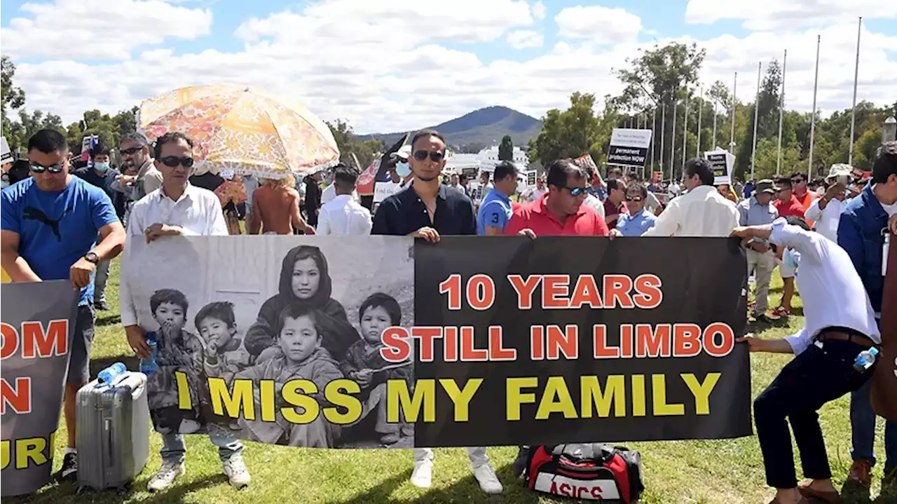 Refugees from Afghanistan rally at Parliament House to demand permanent residency