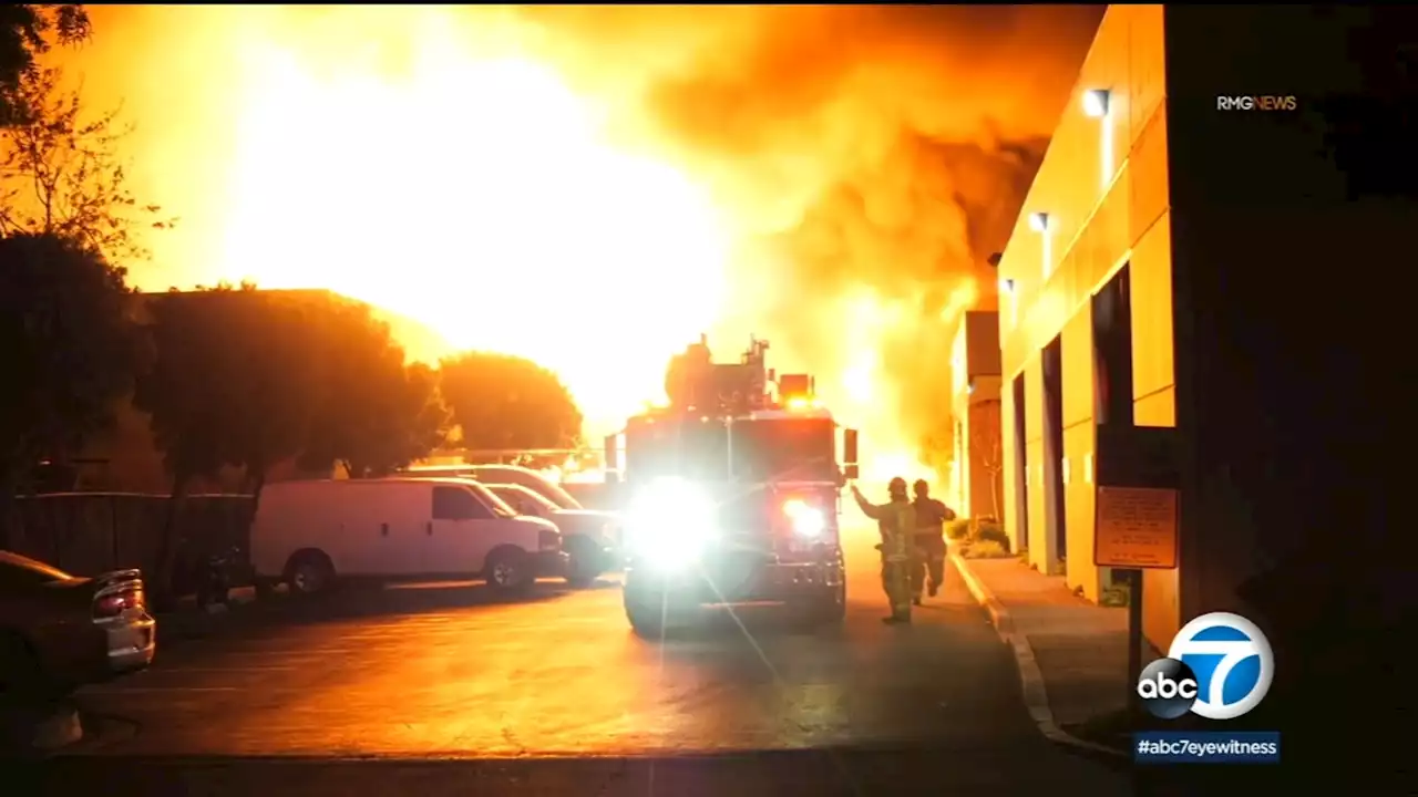 Massive fire rips through foam business in Orange County, sending large plume of smoke into air