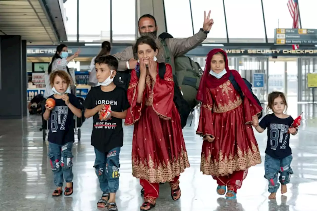 First Afghan refugees arrive at new center in Virginia