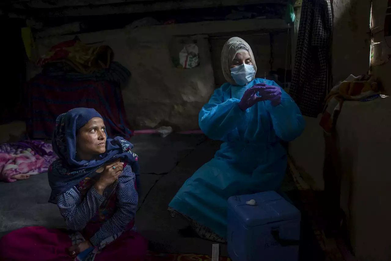 AP PHOTOS: 2 years of images tell the story of the pandemic