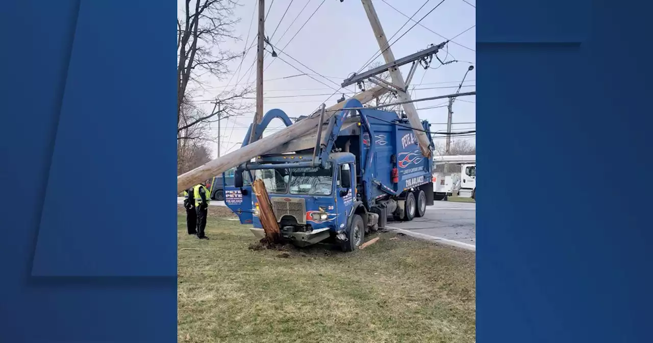 Garbage truck takes out utility pole and power lines in Hudson, causes nearby outages