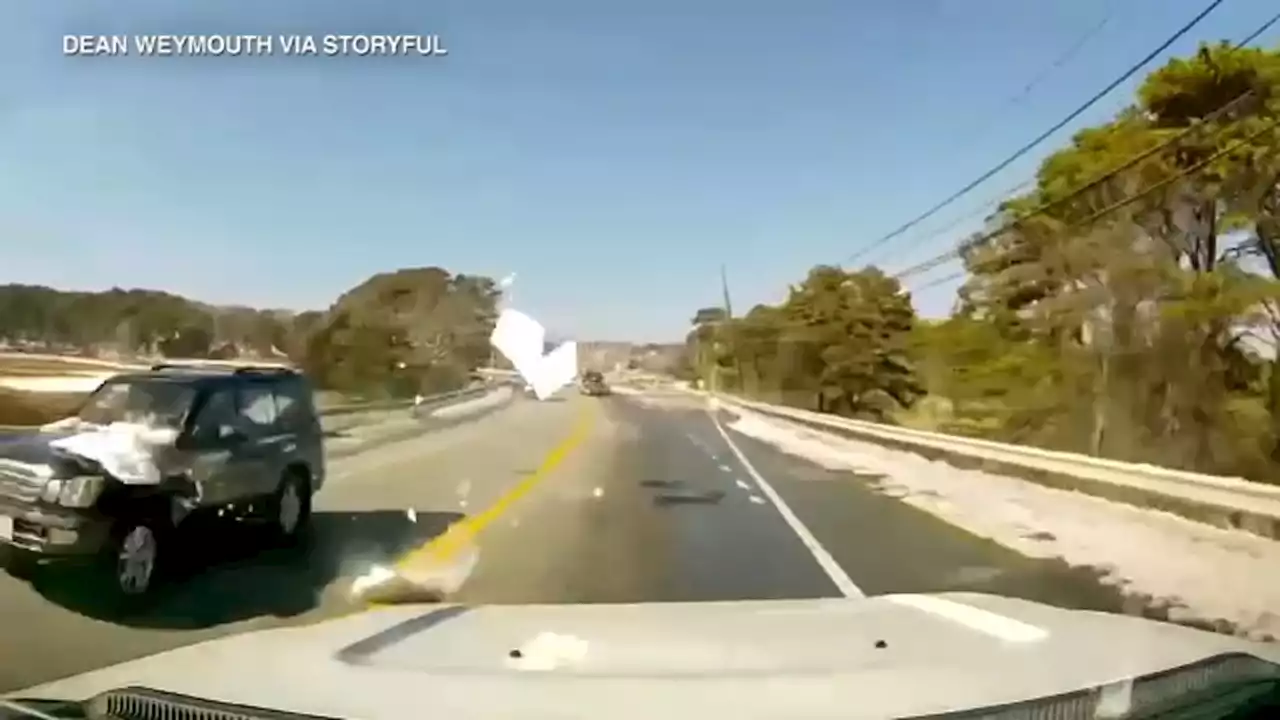 'Clean the ice and snow off your vehicle': Video shows flying ice chunk smash driver's windshield