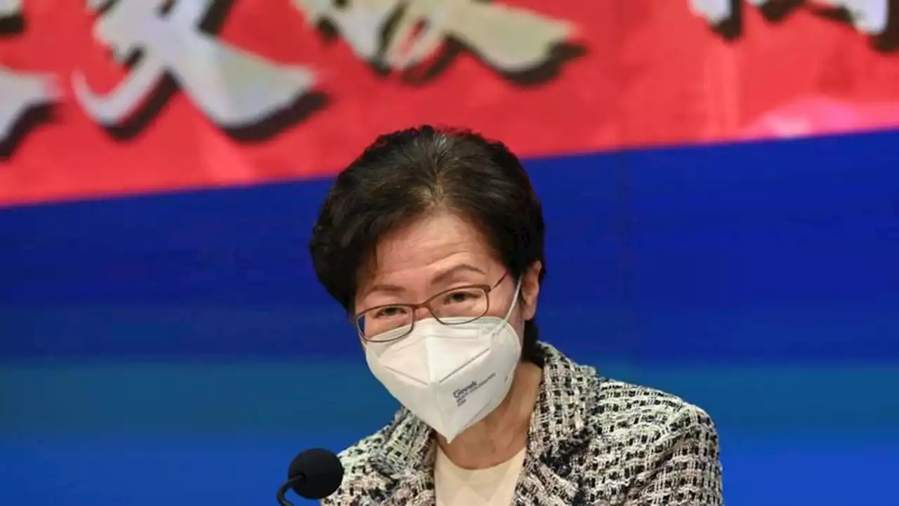 Hong Kong leader says city is not yet past COVID-19 peak