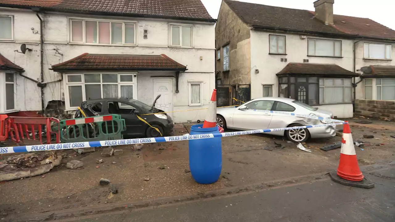 Pedestrian killed and passenger fighting for his life after car ploughs into house