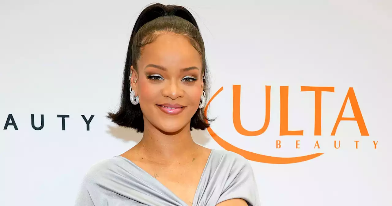 Rihanna sparkles, shows off baby bump in stunning two-piece look