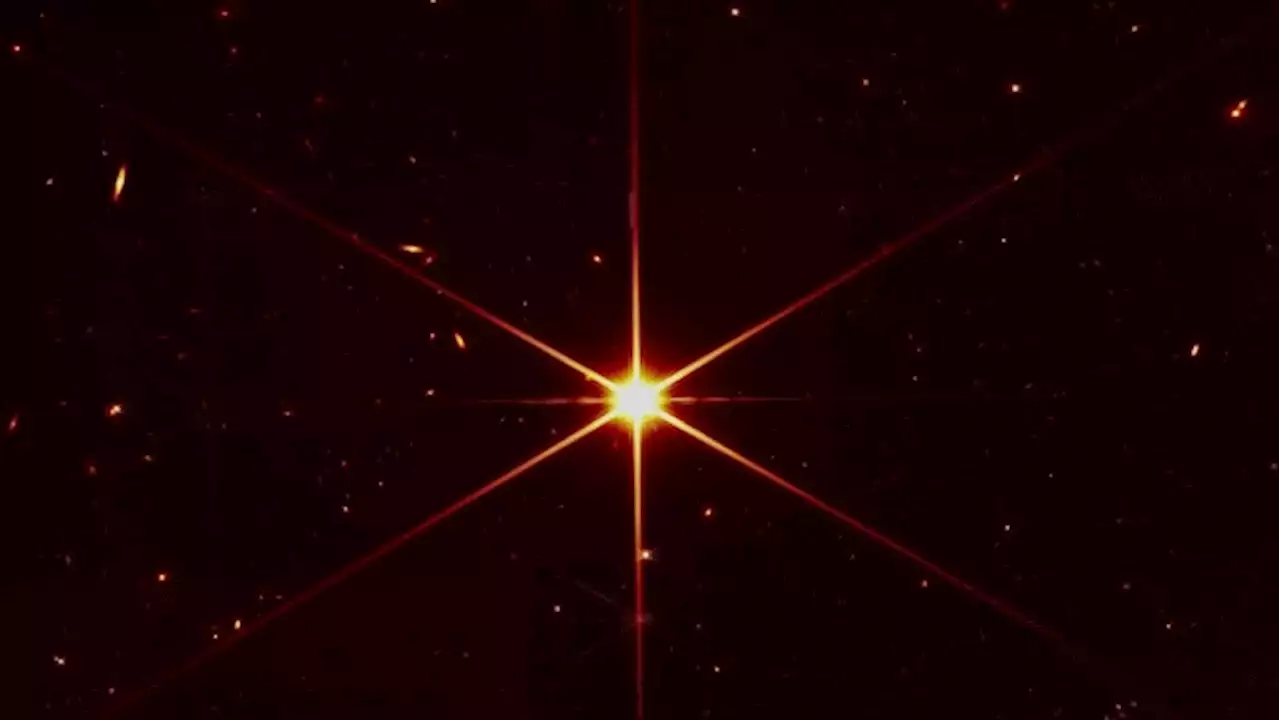 Space telescope's image of star gets photobombed by galaxies
