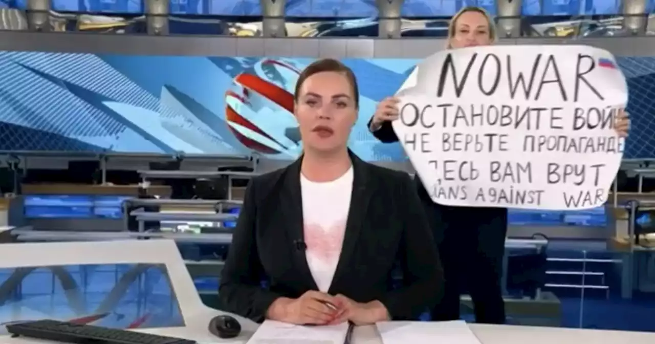 Woman arrested for interrupting Russia state TV with Ukraine protest sign speaks out