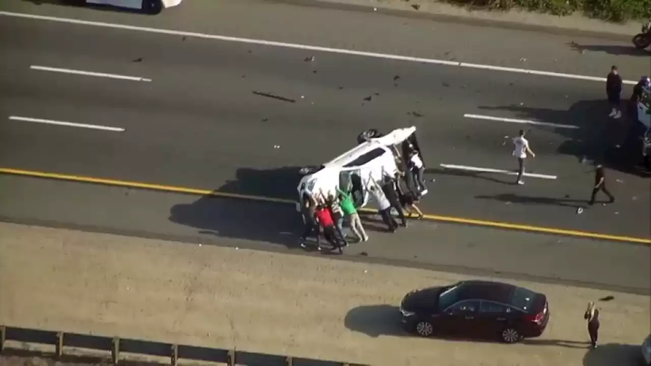 WATCH: Good Samaritans Flip Overturned Pickup Truck After Crash on SR-54