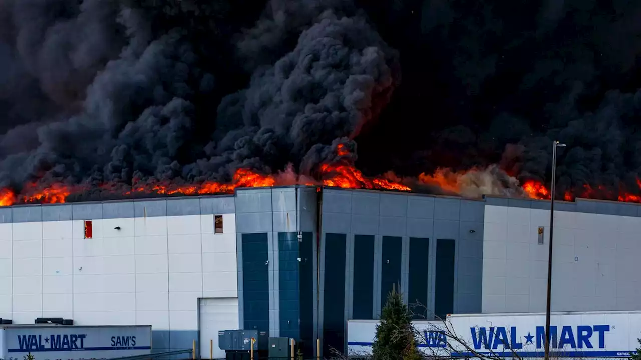 Billowing black smoke seen for miles as massive Walmart distribution center burns in Indiana