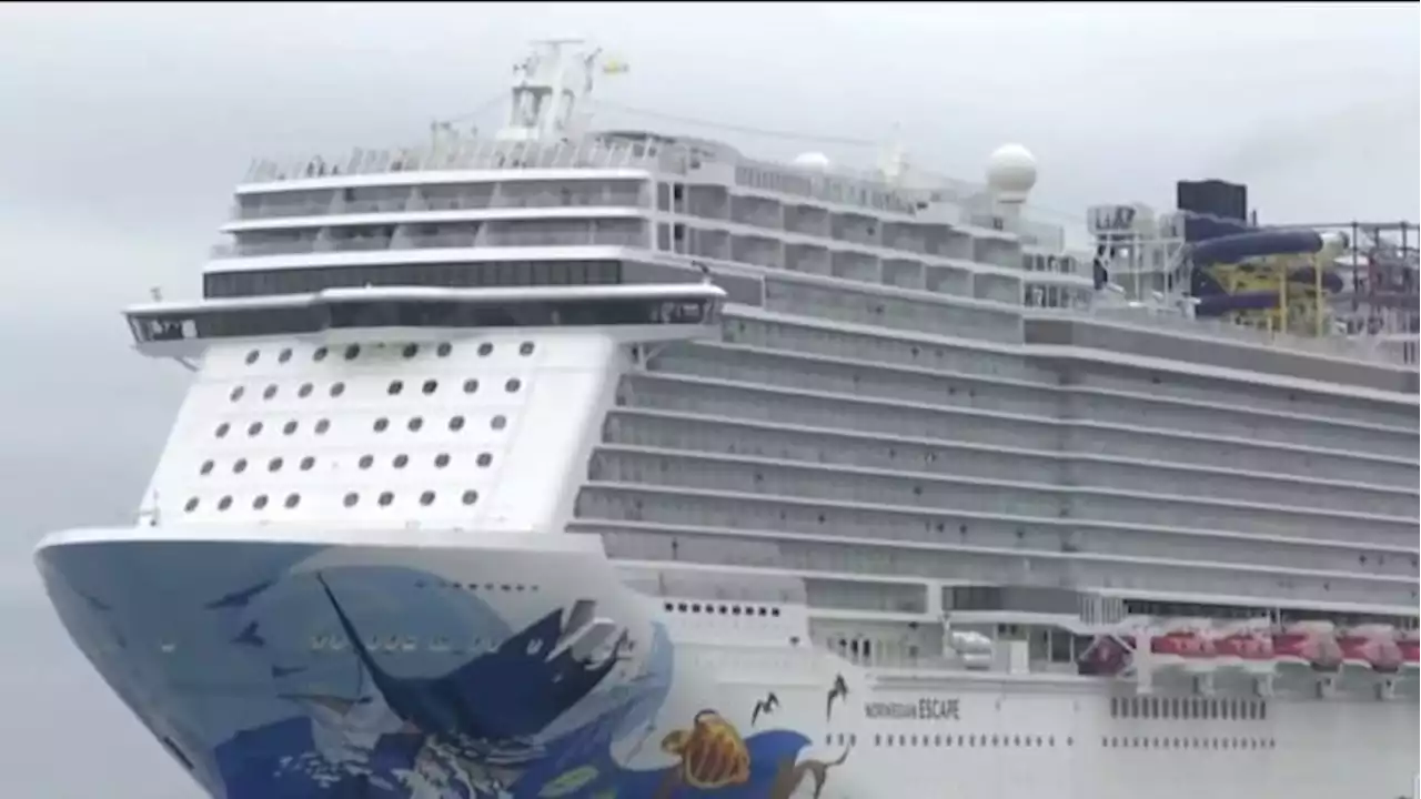 Stuck Norwegian Cruise Lines passengers sing, play, wait for flight home