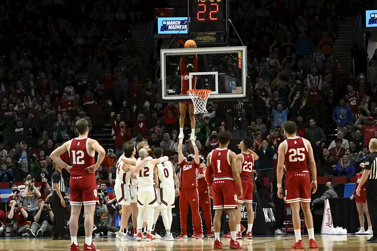 Indiana Cheerleader Rescues Wedged Basketball From Backboard at NCAA Tournament