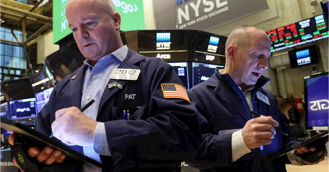 Wall Street closes higher as worries ease around Fed, Russian default