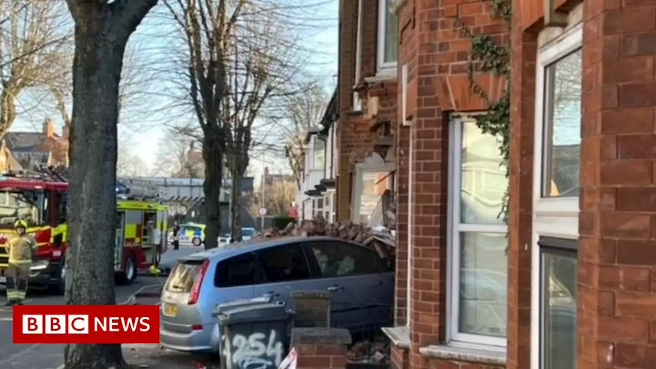 Search for driver after car crashes into Leicester property