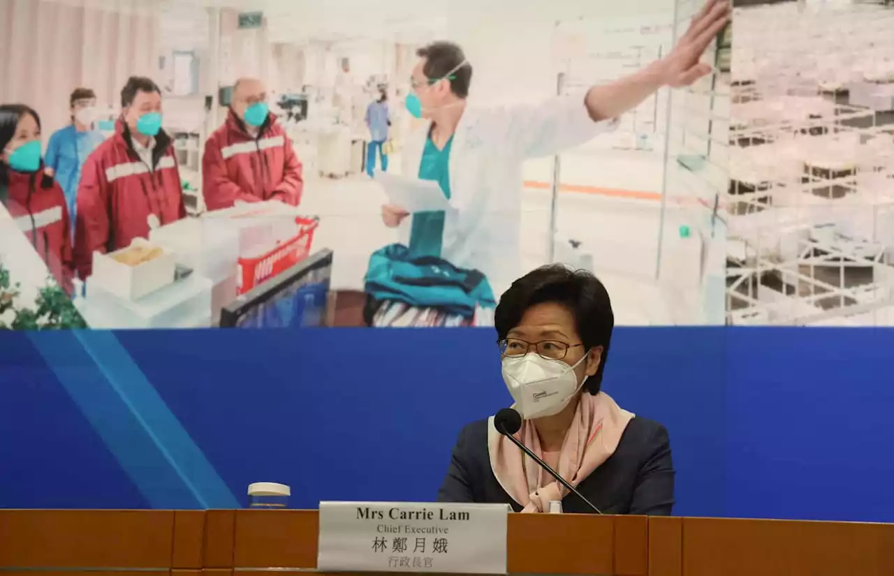 Hong Kong leader defends health workers drafted in from China