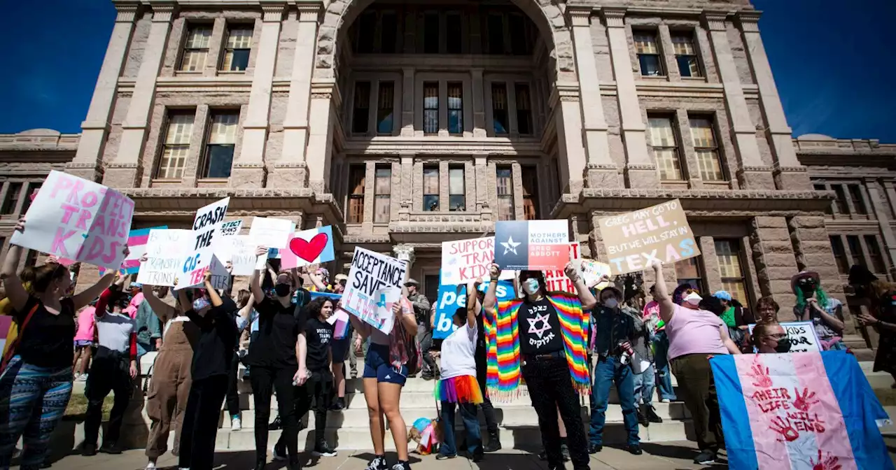 Demonstrators gather at the Texas Capitol to protest Paxton's opinion on health care for trans youth