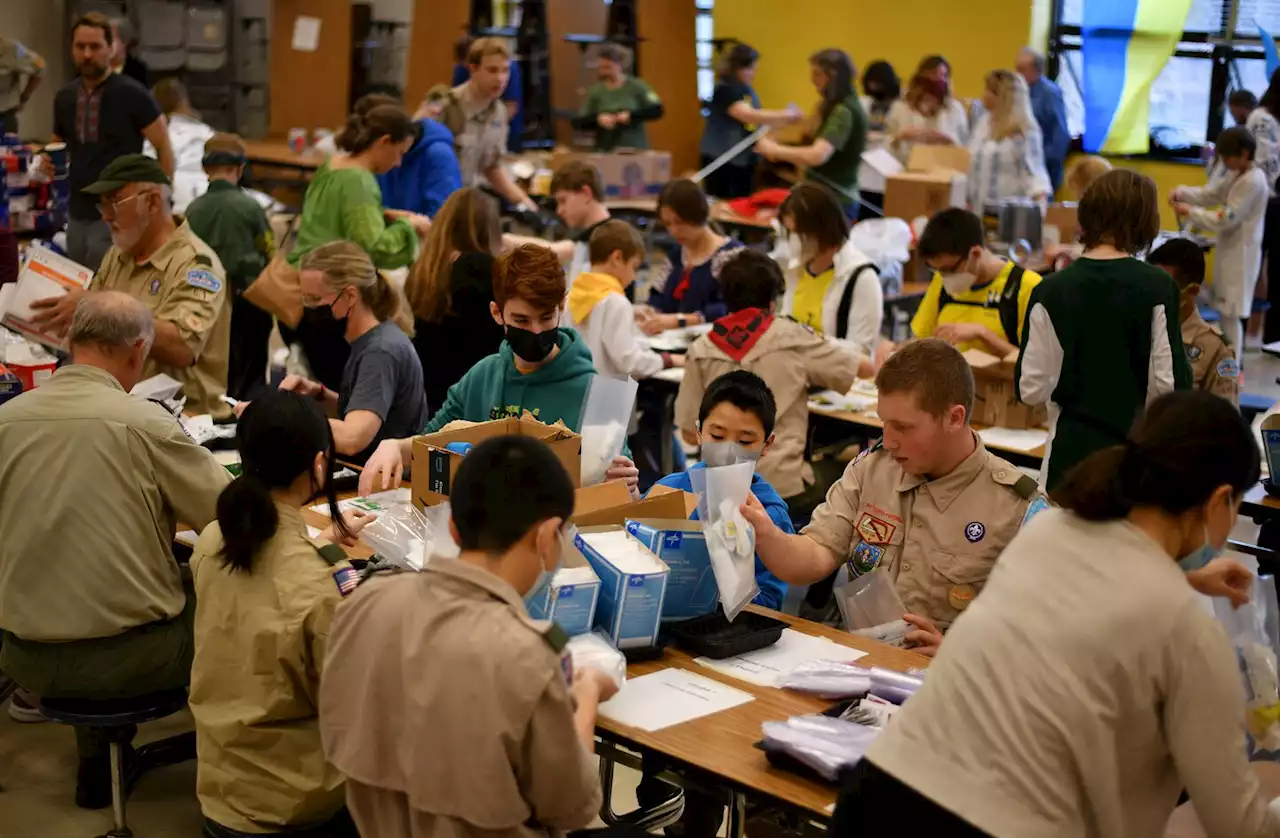 ‘Our hearts are with them’: Ukrainian scouts make first-aid kits to ship overseas