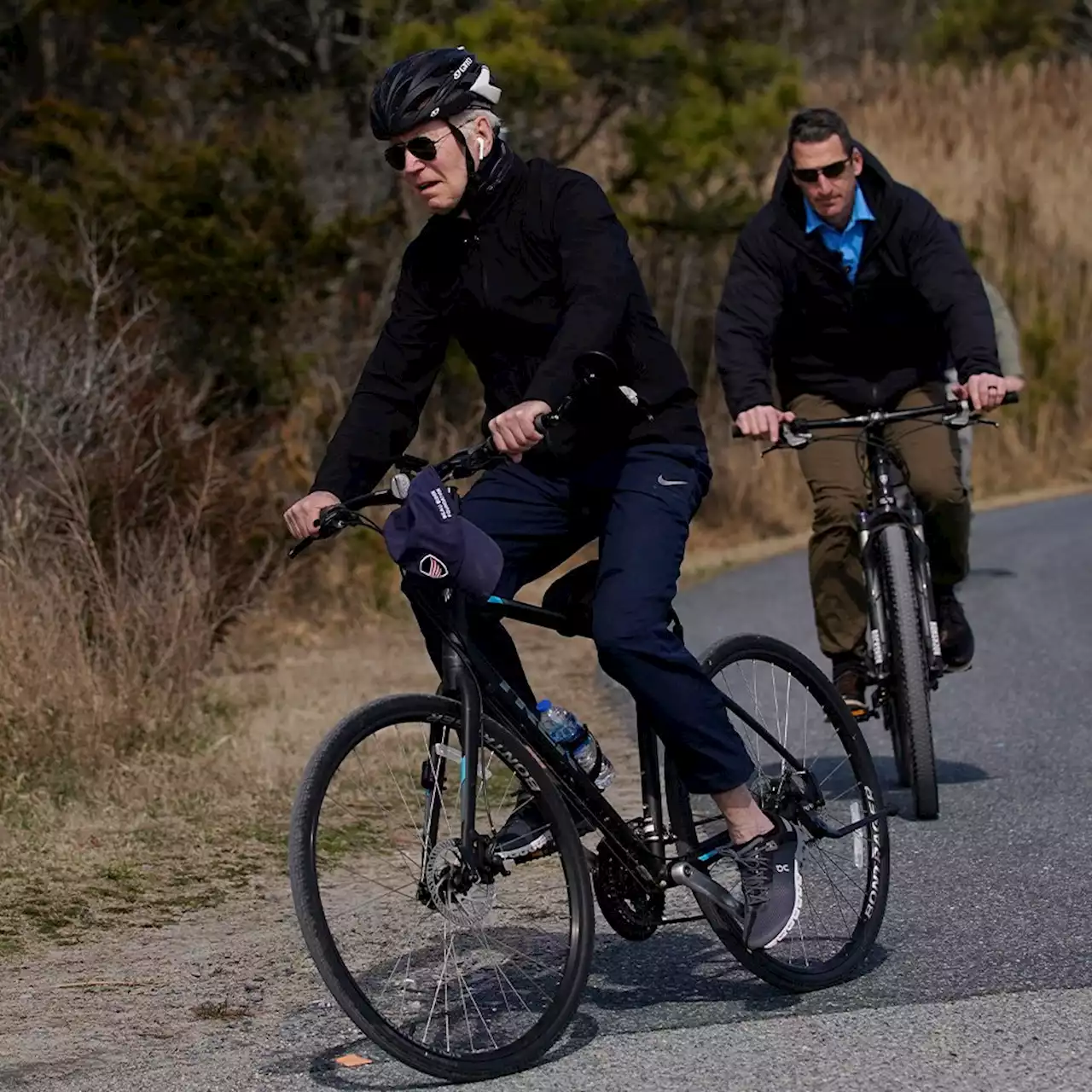 Biden goes for bike ride at the beach as Ukraine president warns of 'third world war'