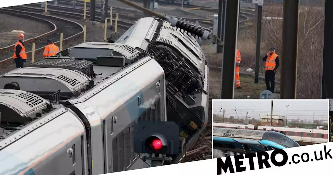 Rush hour train left hanging off tracks after smashing into concrete blocks