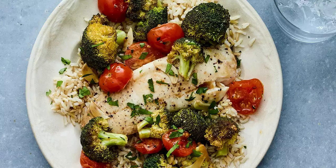 Tilapia in Parchment With Tomato and Broccoli Over Rice