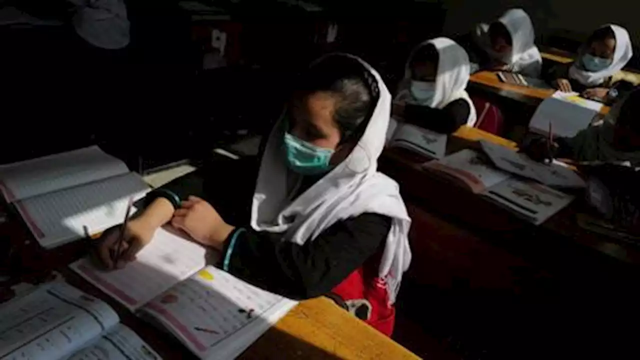 Afghan girls return to school as Taliban ends ban