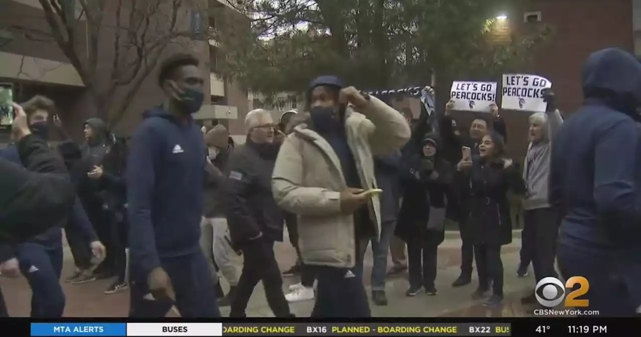 Fans cheer on Saint Peter's University basketball team as they head to Philly