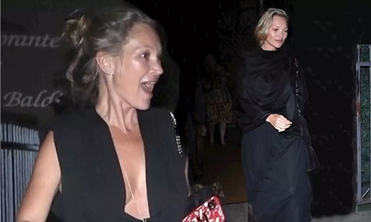 Kate Moss cuts her typically stylish figure in a floor-length dress