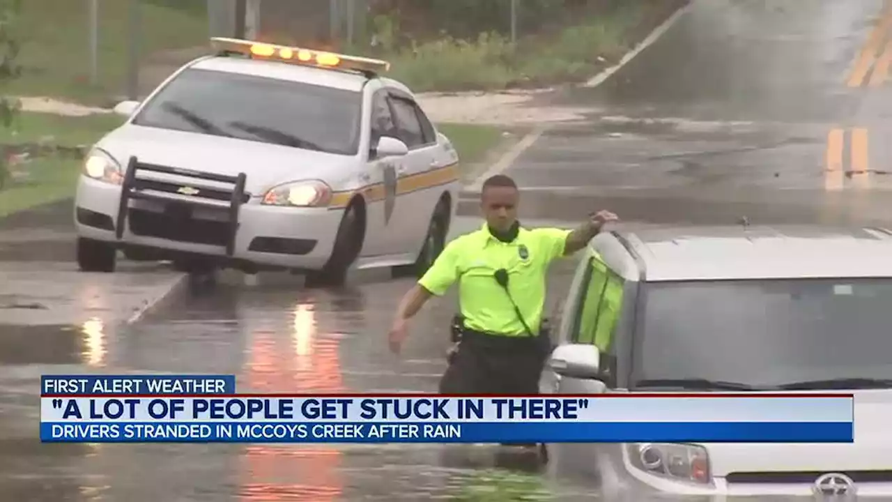 McCoy Creek flooding traps two cars while city continues flood mitigation project