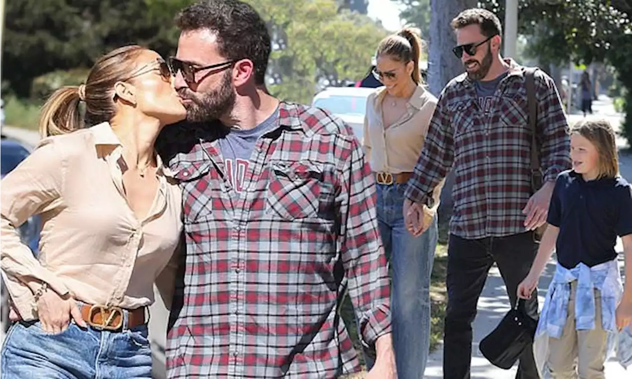 Jennifer Lopez and Ben Affleck kiss while strolling with his son