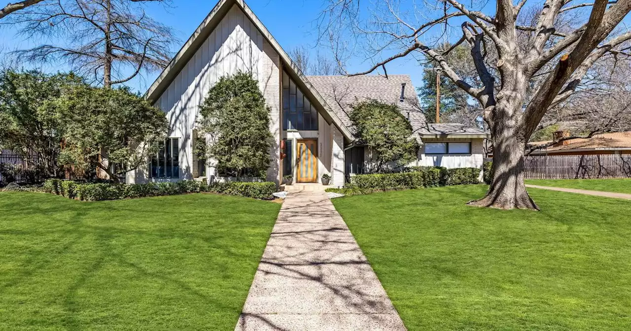 This mid-century Dallas home has original details including a built-in planter under the staircase